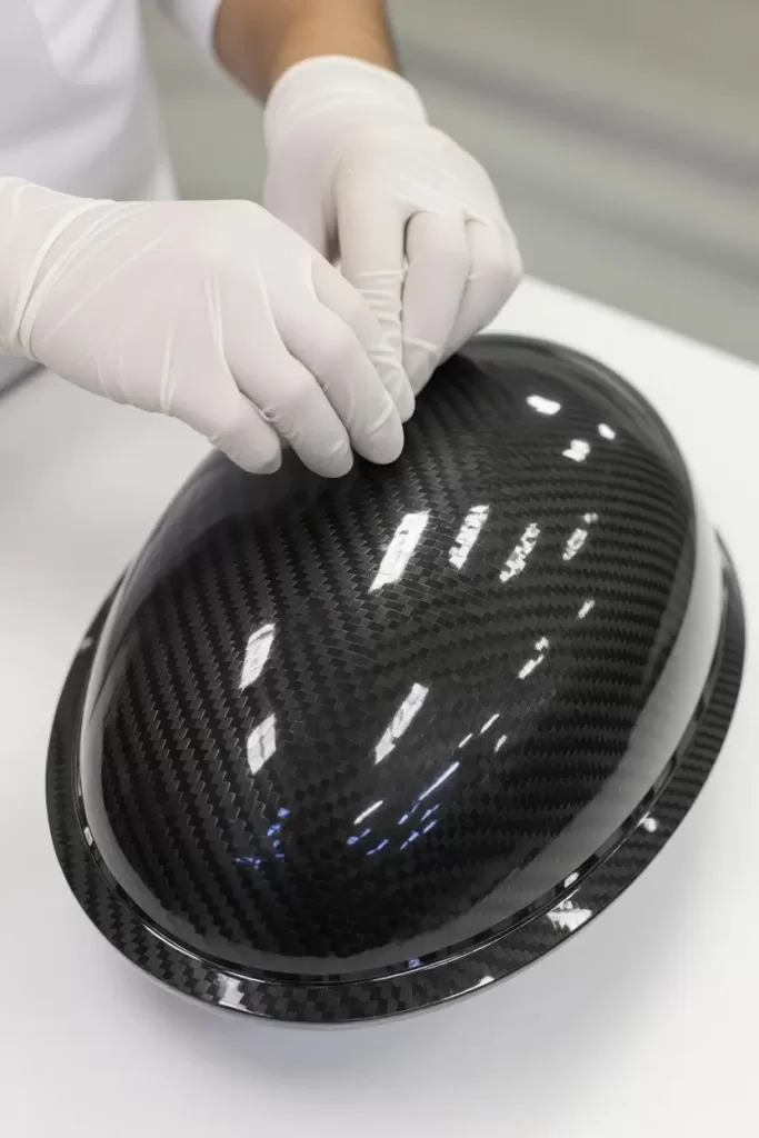 A carbon fiber component on a table